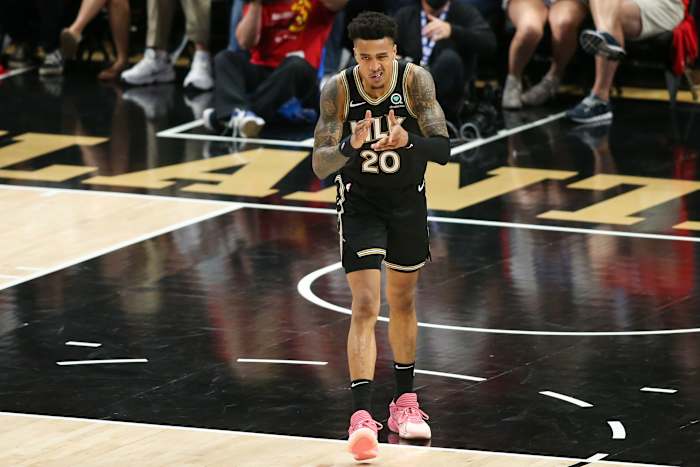 Atlanta Hawks forward John Collins (20) celebrates after a dunk against the Philadelphia 76ers in the third quarter during game four in the second round of the 2021 NBA Playoffs at State Farm Arena.